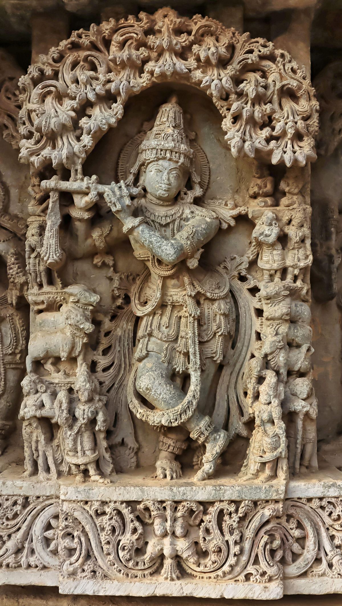 Photograph of a sculpture of Lord Krishna playing a flute.