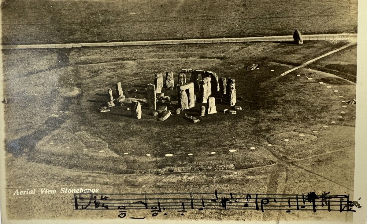 Postcard showing a photograph of Stonehenge, with a short musical phrase from her composition written on it by Susan Spain-Dunk