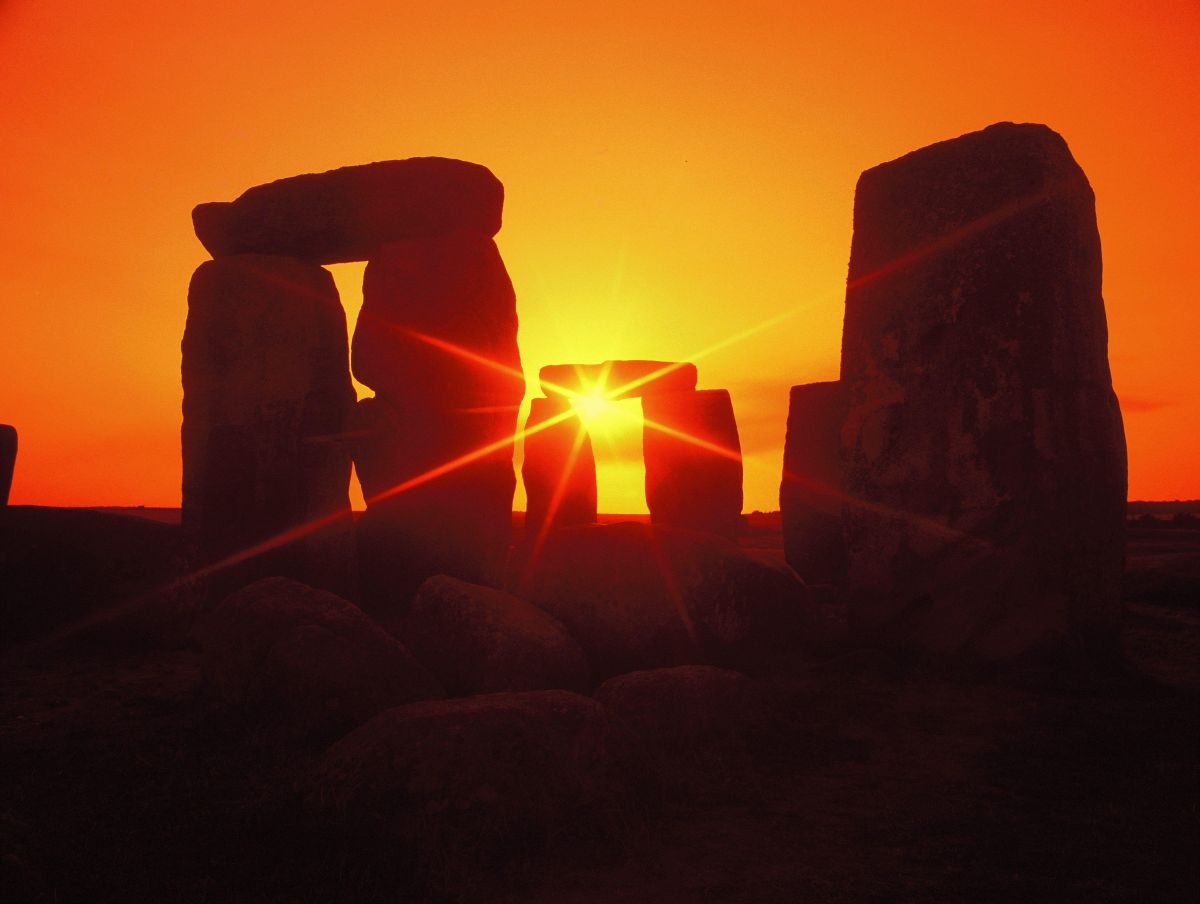 Photograph showing the standing stones at Stonehenge at sunset