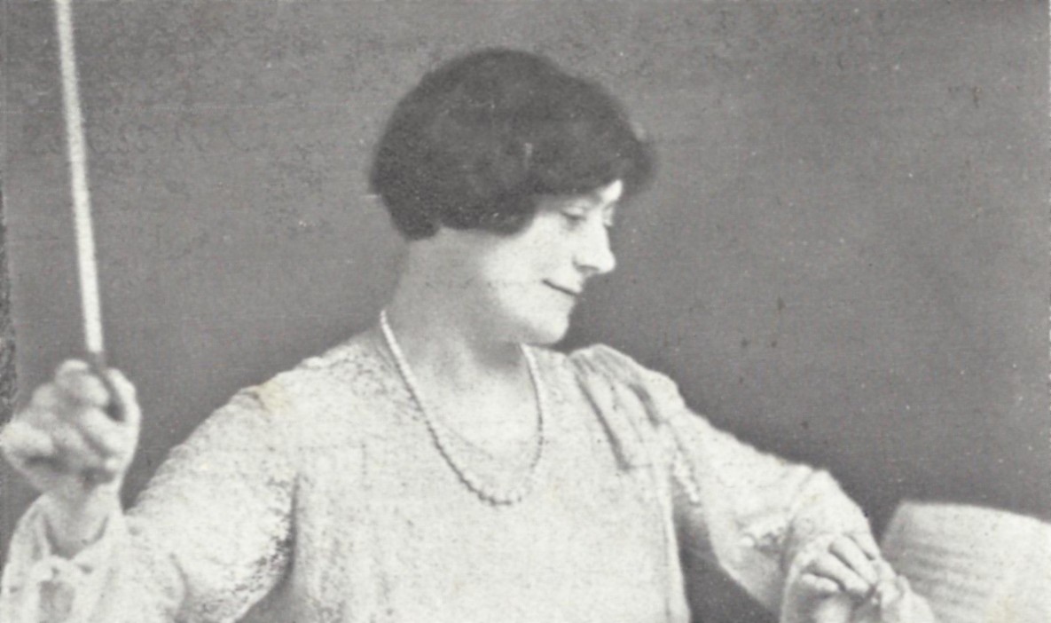 Photograph of Susan Spain-Dunk conducting music